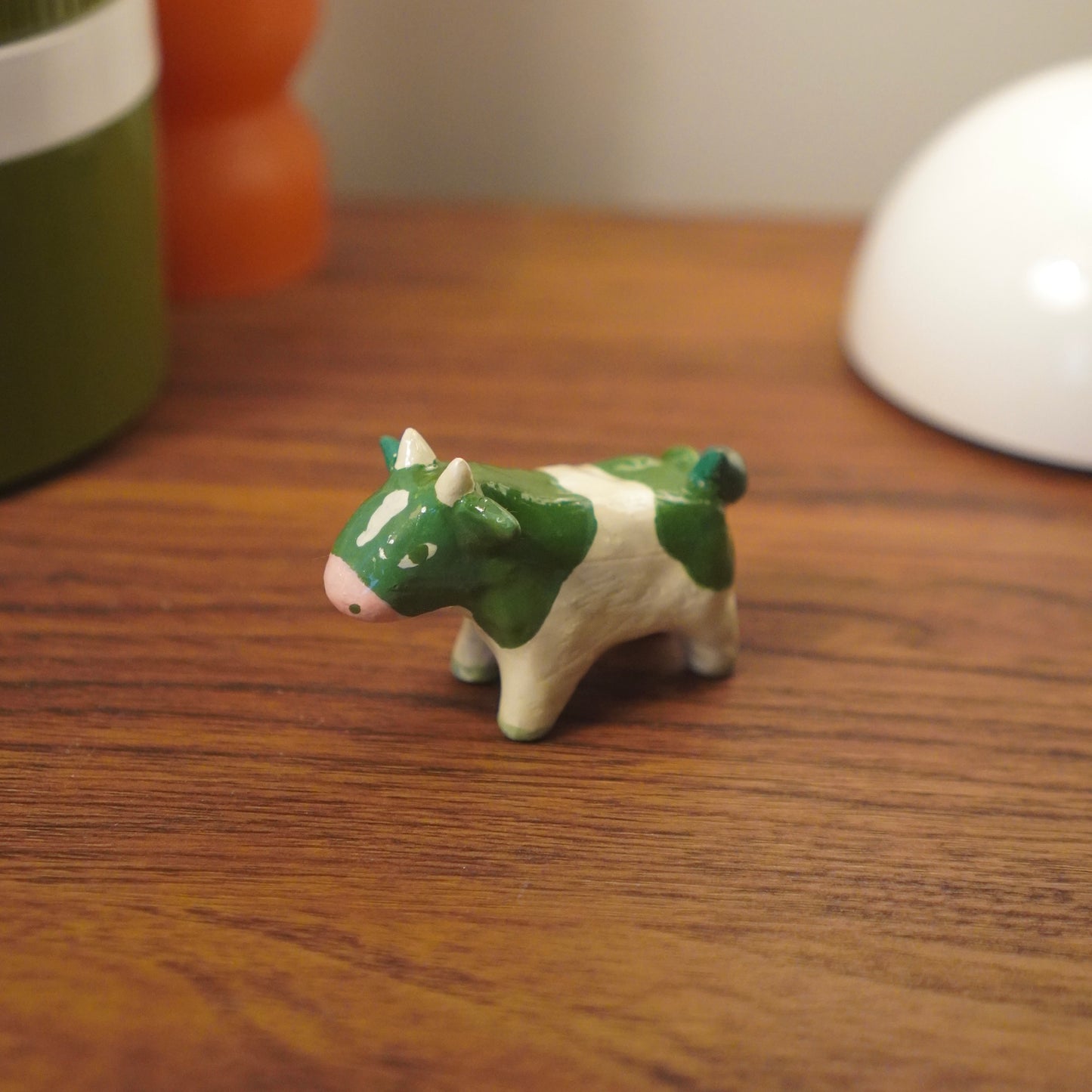 green cow figurine