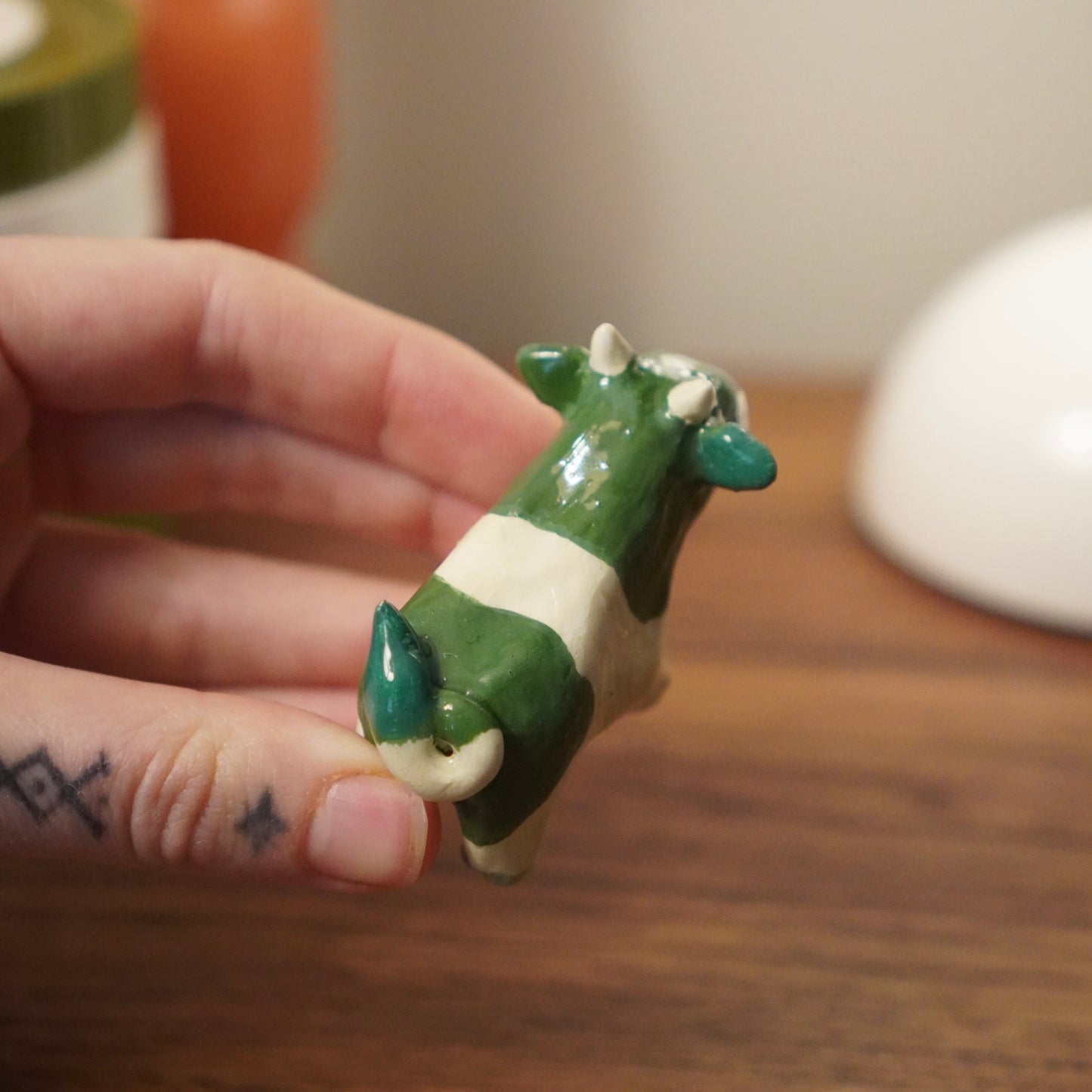 green cow figurine