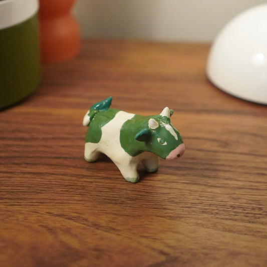 green cow figurine