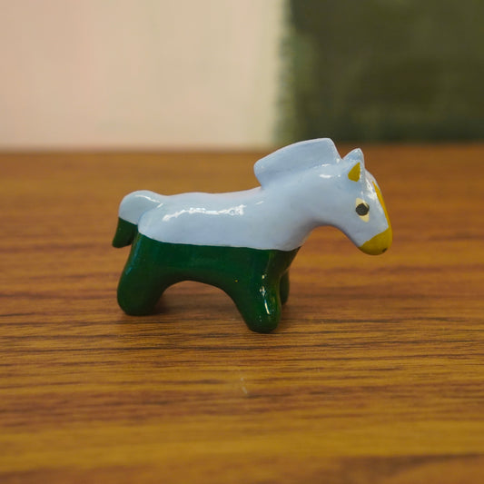 weird pants horse figurine